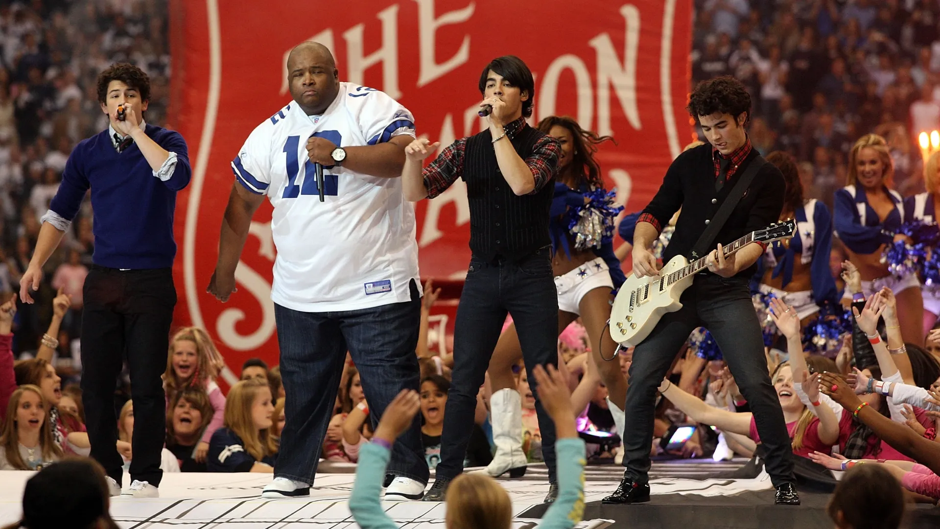 The Jonas Brothers perform with Big Rob during halftime between the Seahawks and the Cowboys in 2008 (Source: Ronald Martinez/Getty Images)