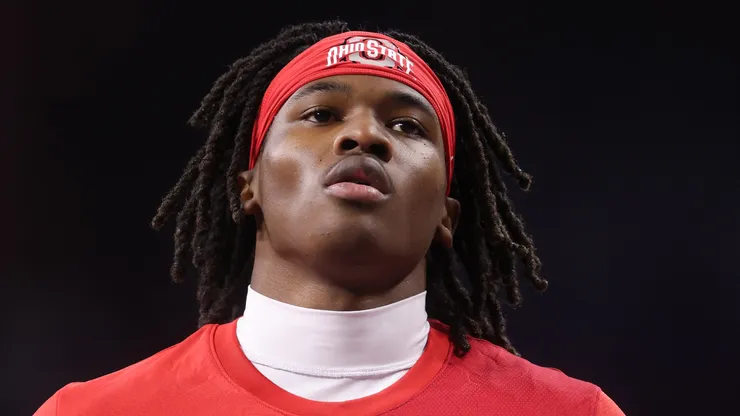 Jeremiah Smith #4 of the Ohio State Buckeyes looks on during warmups.