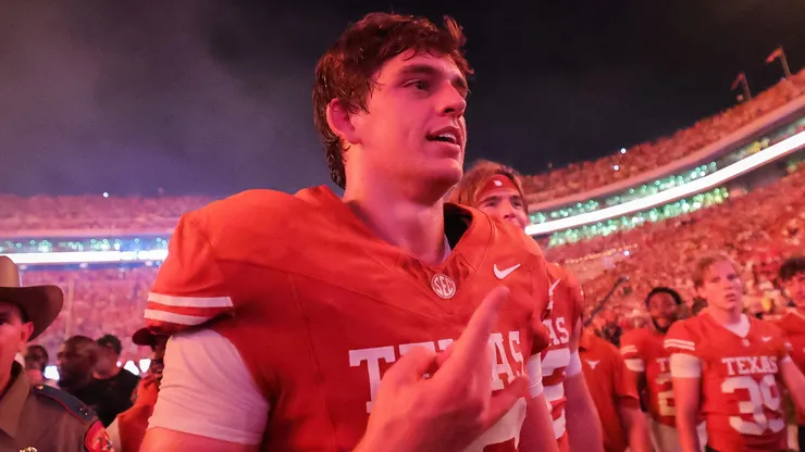 Arch Manning #16 of the Texas Longhorns celebrates after a win against the Ohio State Buckeyes.