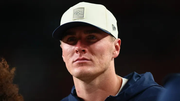 Bo Nix #10 of the Denver Broncos looks on from the sidelines during the second quarter.