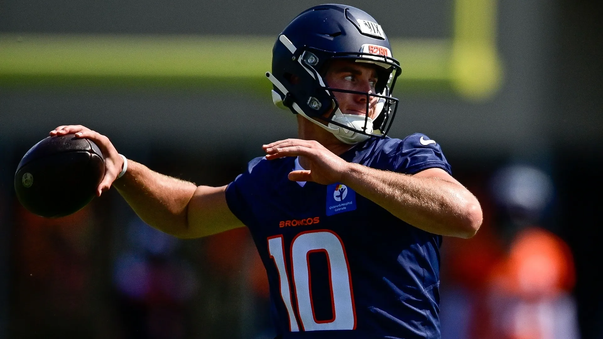 Bo Nix #10 of the Denver Broncos throws a pass during training camp (Source: Dustin Bradford/Getty Images)