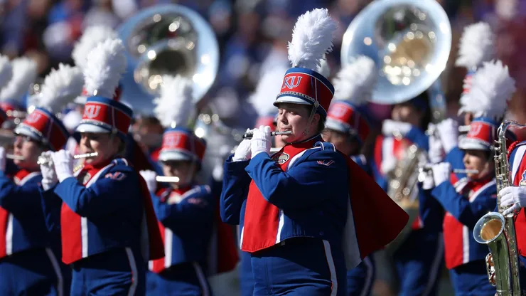 Members of the University of Kansas marching band perform prior to a game