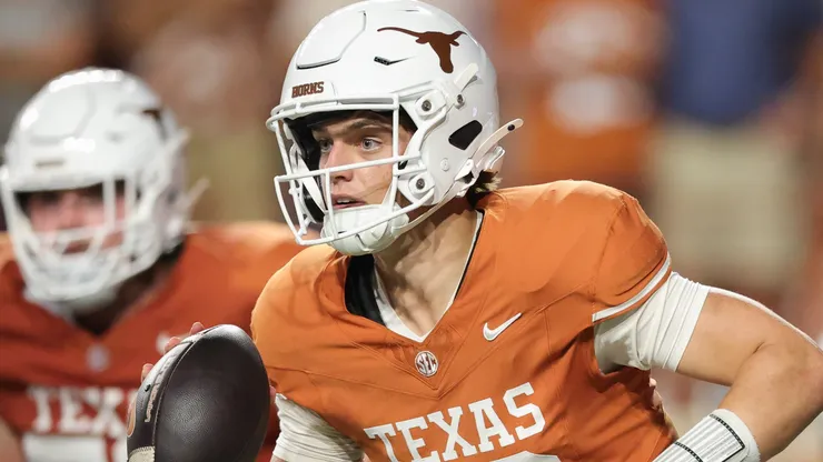 Arch Manning #16 of the Texas Longhorns runs the ball against the Ohio State Buckeyes.