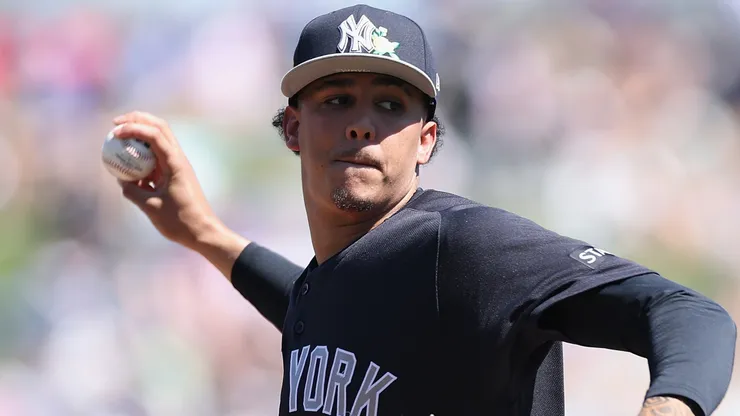 Carlos Lagrange #84 of the New York Yankees throws a warm-up pitch.