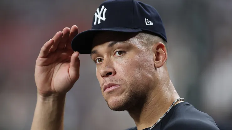 Aaron Judge #99 of the New York Yankees looks on from the dugout during sixth inning.