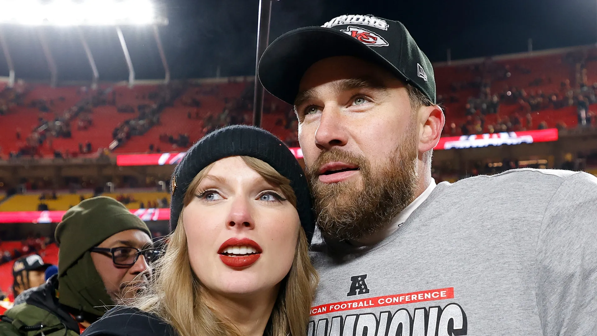 Taylor Swift celebrates with Travis Kelce #87 of the Kansas City Chiefs after defeating the Buffalo Bills 32-29 in the AFC Championship Game at GEHA Field at Arrowhead Stadium on January 26, 2025 in Kansas City, Missouri.