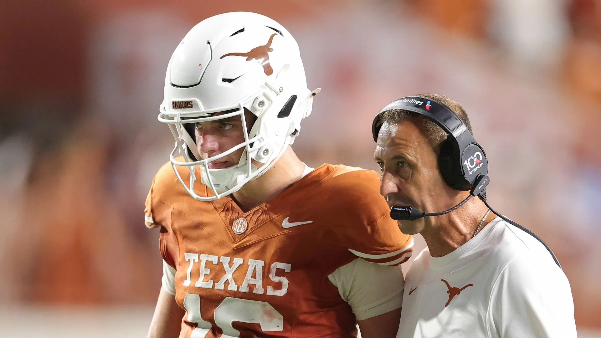 Head coach Steve Sarkisian of the Texas Longhorns speaks with Arch Manning #16 of the Texas Longhorns during the fourth quarter against the Ohio State Buckeyes at Darrell K Royal-Texas Memorial Stadium on September 12, 2026 in Austin, Texas.
