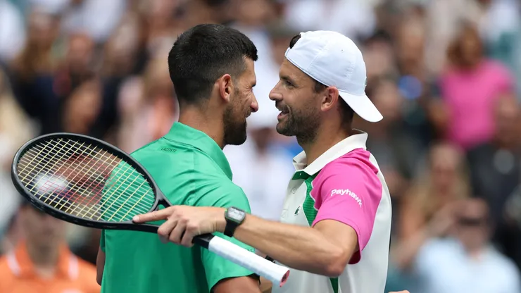 Novak Djokovic meets Grigor Dimitrov at the net after a Miami Open semifinal in 2025.