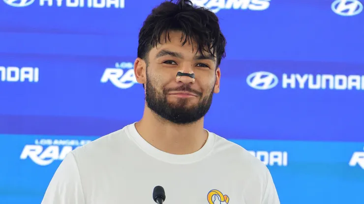 Puka Nacua #12 of the Los Angeles Rams smiles during a press conference.
