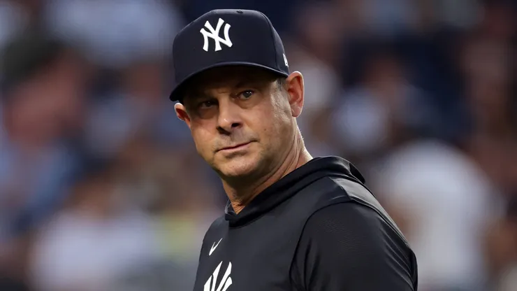 Aaron Boone #17 of the New York Yankees walks back to the dugout.