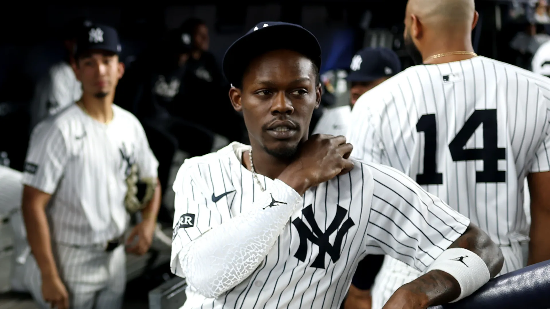 Jazz Chisholm Jr. #13 of the New York Yankees look on in the dugout before the game against the Toronto Blue Jays in game three of the American League Division Series at Yankee Stadium on October 07, 2025 in the Bronx borough of New York City.
