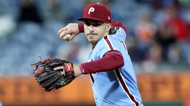 Bryson Stott #5 of the Philadelphia Phillies throws to first base.
