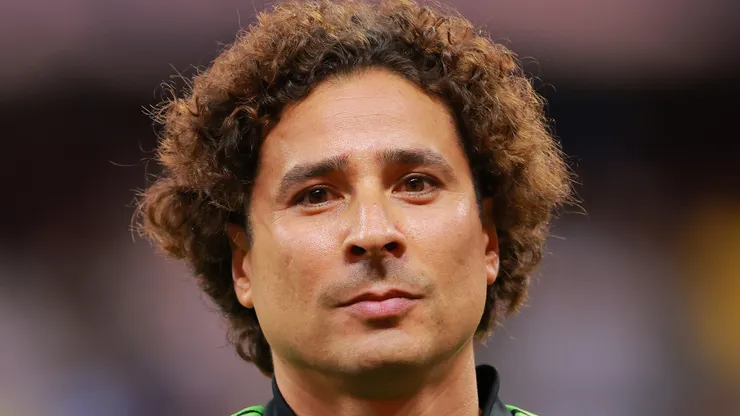 Guillermo Ochoa looks on.