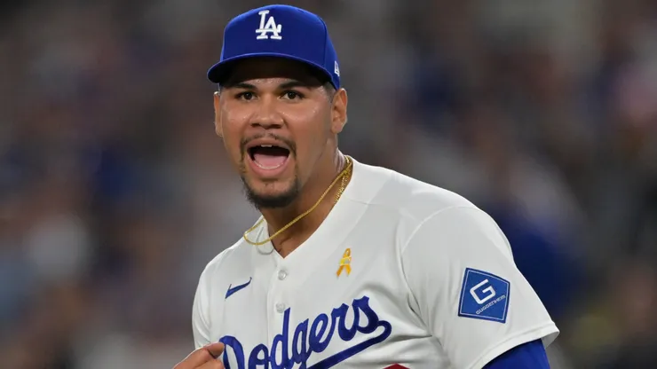 Edgardo Henriquez #60 of the Los Angeles Dodgers reacts after striking out CJ Abrams.