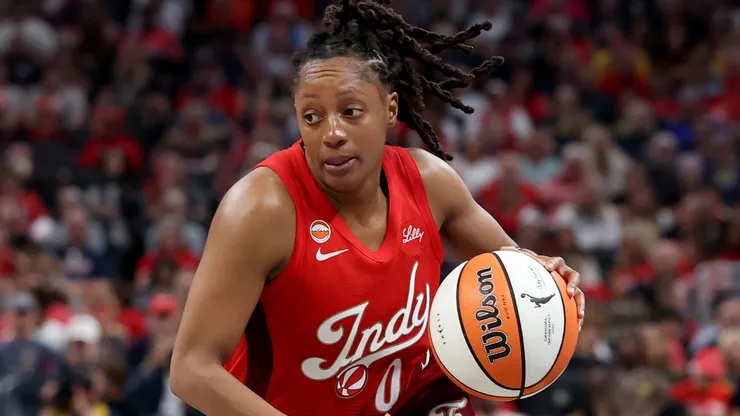 Kelsey Mitchell #0 of the Indiana Fever dribbles the ball.