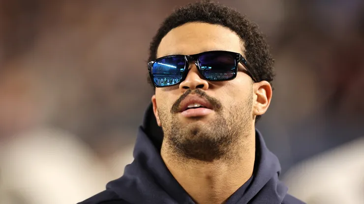Caleb Williams #18 of the Chicago Bears looks on from the sidelines.
