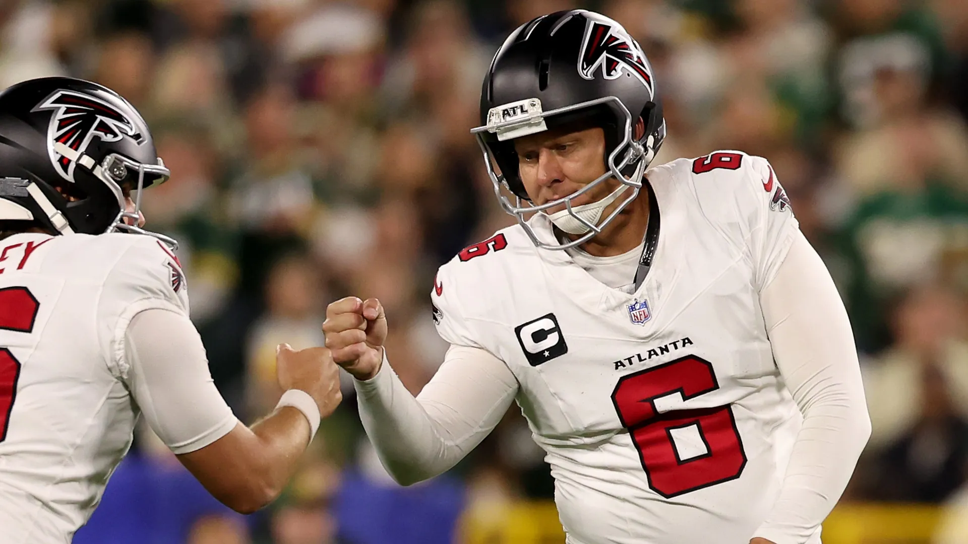 Nick Folk #6 celebrates with Jake Bailey #16 (Source: Geoff Stellfox/Getty Images)