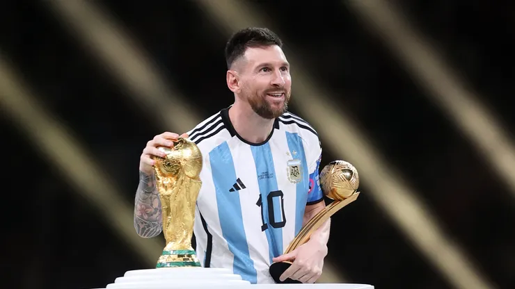 Lionel Messi with the World Cup trophy and Golden Ball award after the Qatar 2022 final.