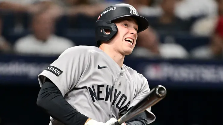 Ben Rice #22 of the New York Yankees hits a solo home run.