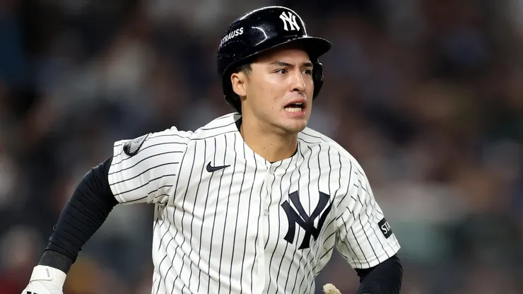 Anthony Volpe #11 of the New York Yankees runs to first base.