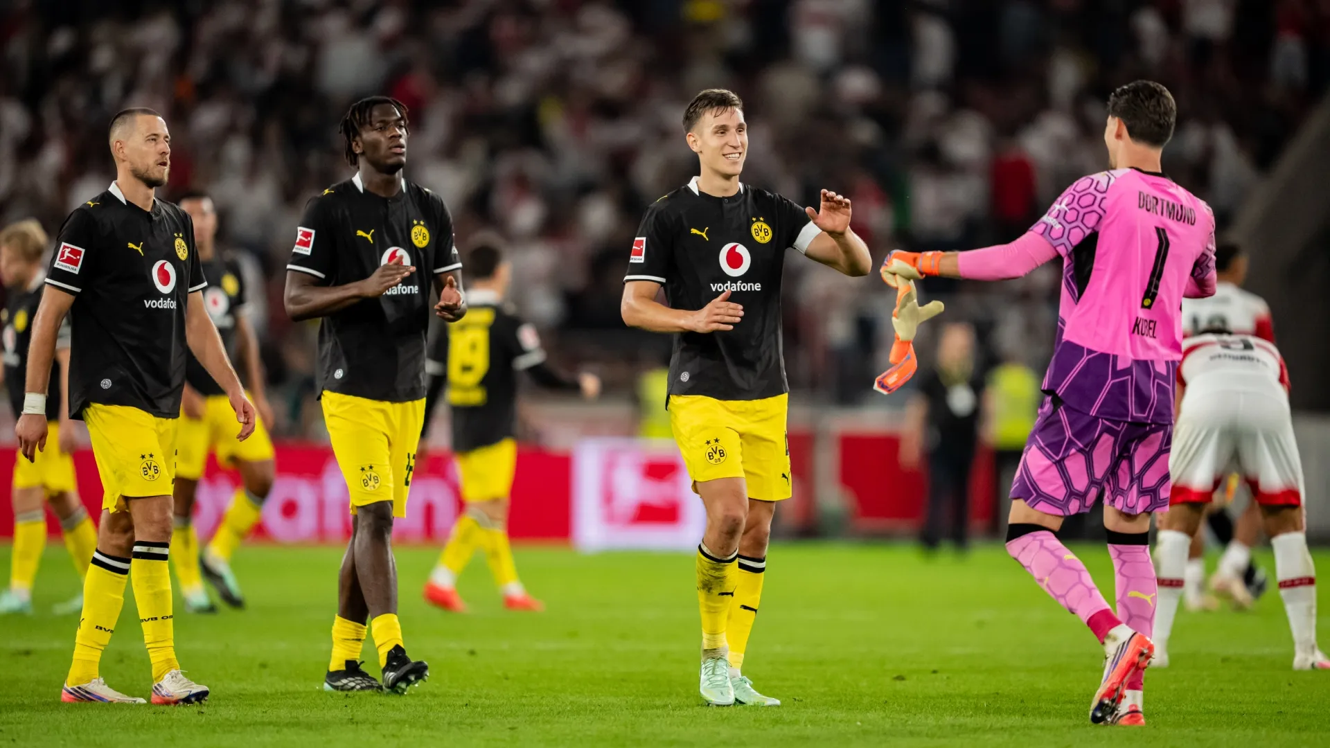 Nico Schlotterbeck celebrates the victory with Gregor Kobel of team Dortmund (Source: Sona Maleterova/Getty Images)