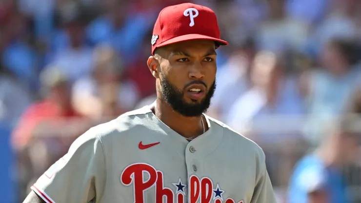 Cristopher Sánchez #61 of the Philadelphia Phillies walks to the dugout.