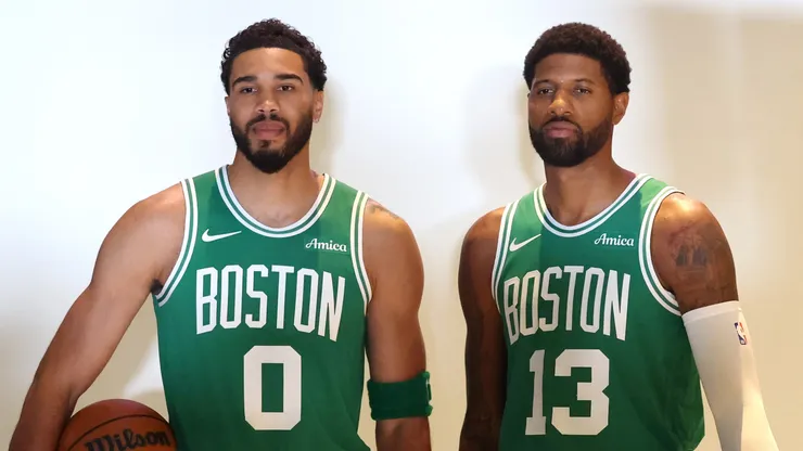 Jayson Tatum #0 and Paul George #13 of the Boston Celtics pose for photos.