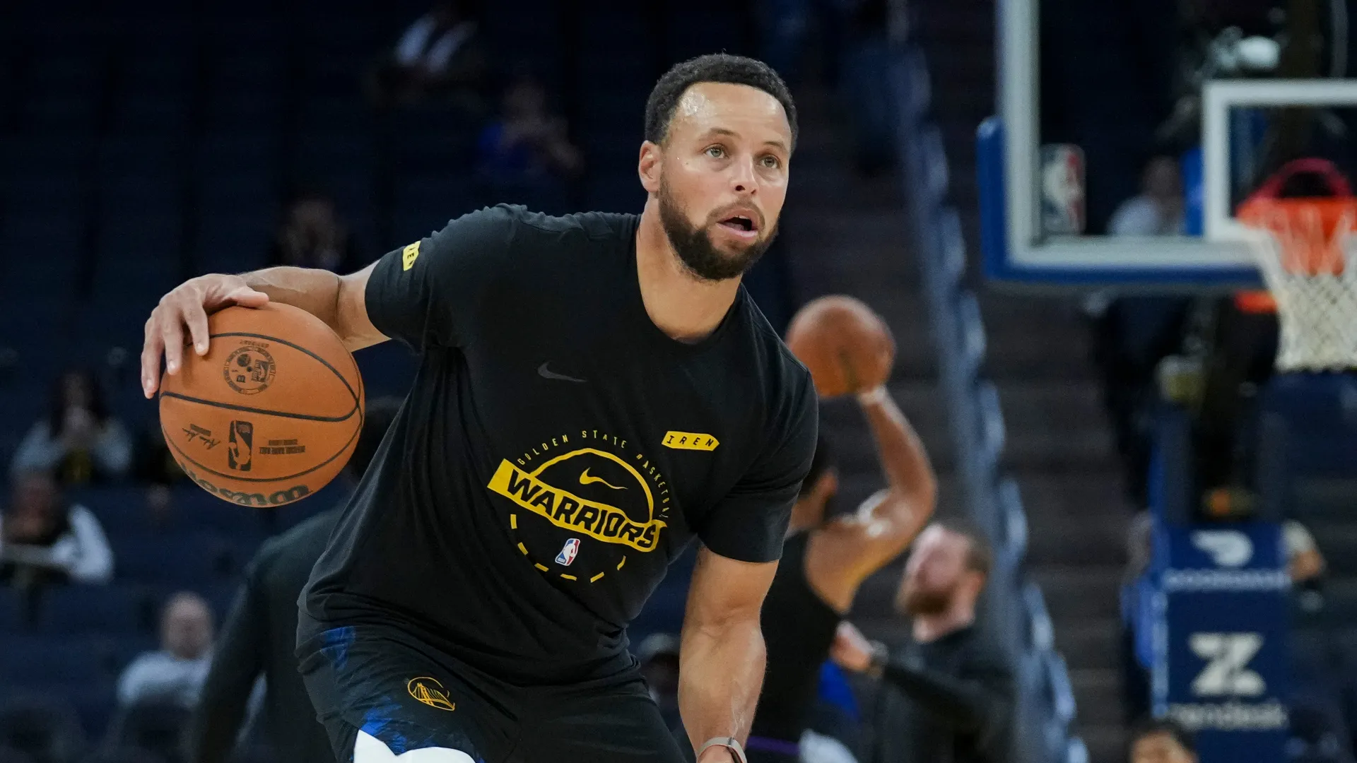 Stephen Curry of Golden State Warriors dribbling the ball.