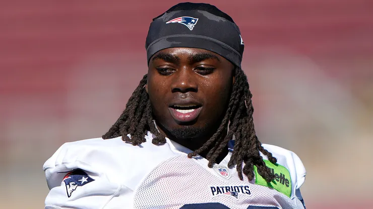 Rhamondre Stevenson #38 of the New England Patriots participates in drills.