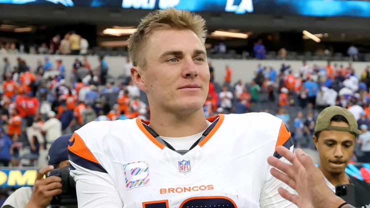 Bo Nix #10 and Evan Engram #1 of the Denver Broncos react.