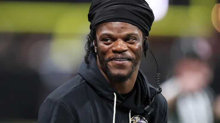 Lamar Jackson #8 of the Baltimore Ravens looks on from the sidelines.