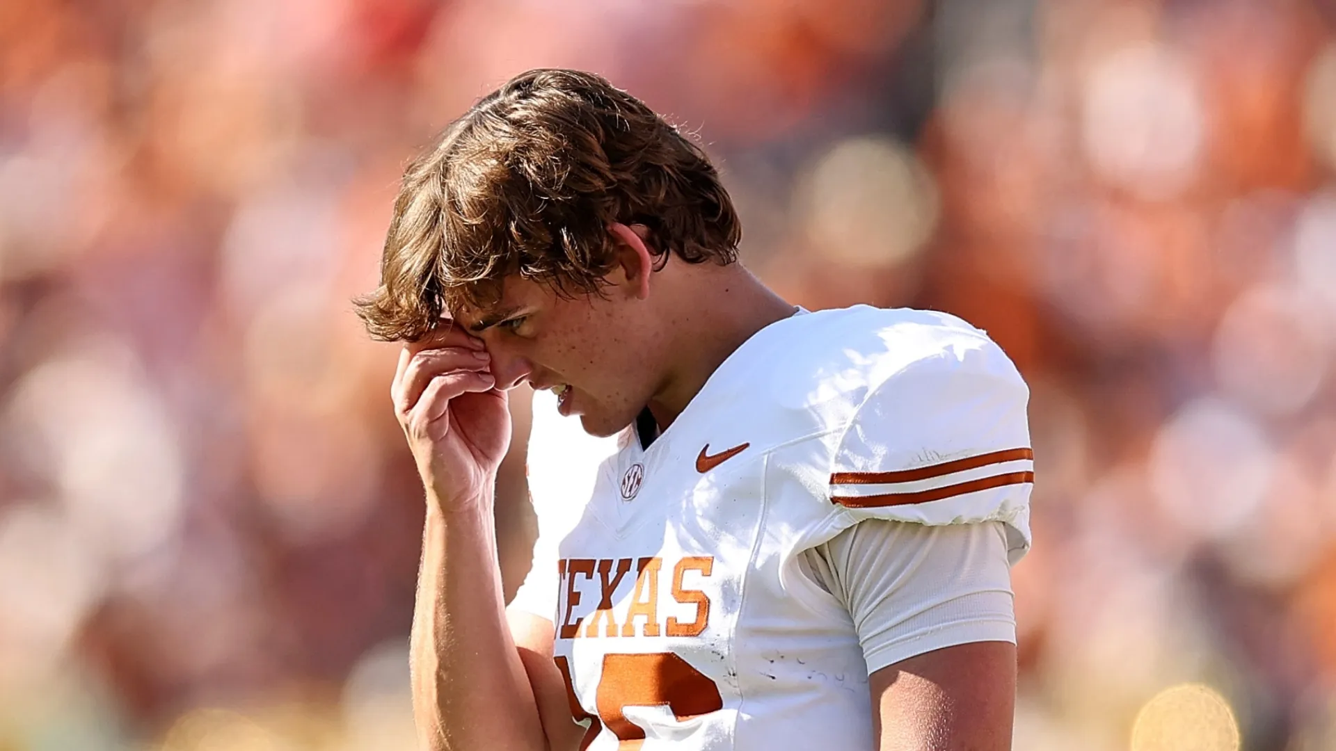 Arch Manning #16 of the Texas Longhorns stands on the sideline during a game against the Oklahoma Sooners at Cotton Bowl on October 10, 2026 in Dallas, Texas.