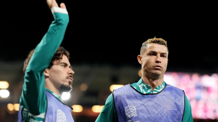 Cristiano Ronaldo and Vitinha of Portugal warm up.