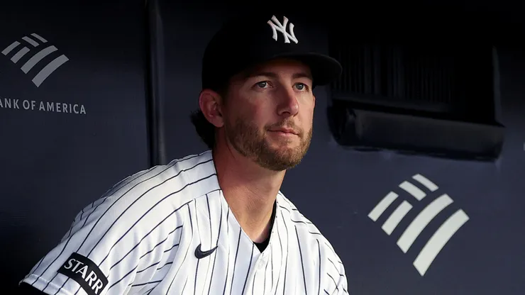 Ryan McMahon #19 of the New York Yankees looks on from the dugout.