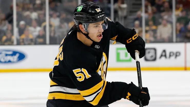 Matthew Poitras #51 of the Boston Bruins shoots the puck.
