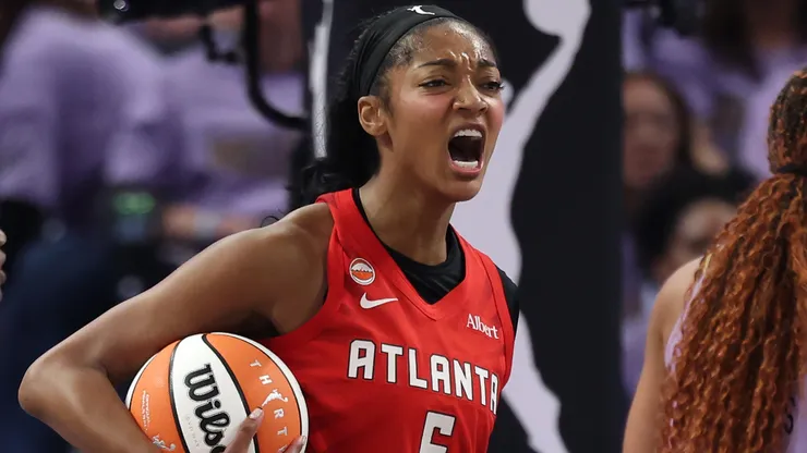 Angel Reese #5 of the Atlanta Dream reacts between Tiffany Hayes #15 and Kiah Stokes #41.