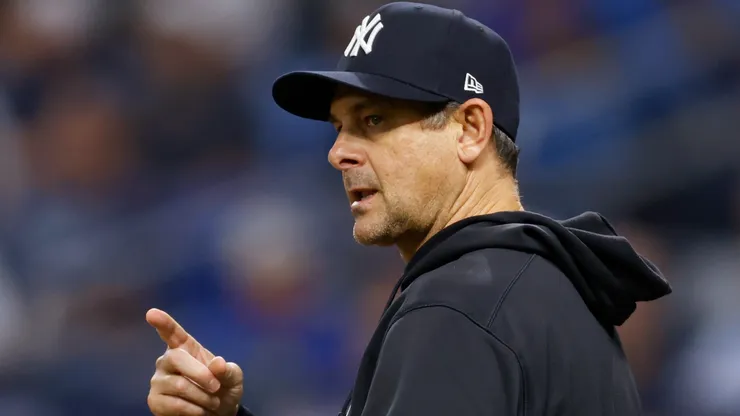 Manager Aaron Boone #17 of the New York Yankees gestures.