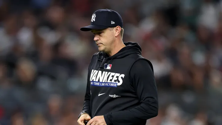 Pitching coach Matt Blake #77 of the New York Yankees walks back.