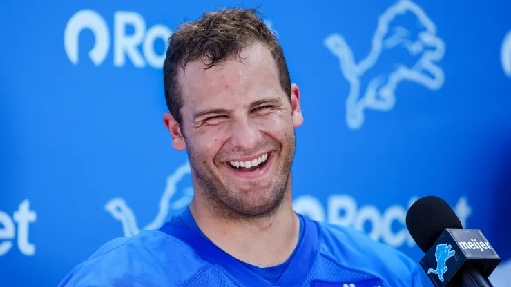 Sam LaPorta #87 of the Detroit Lions talks with the press.