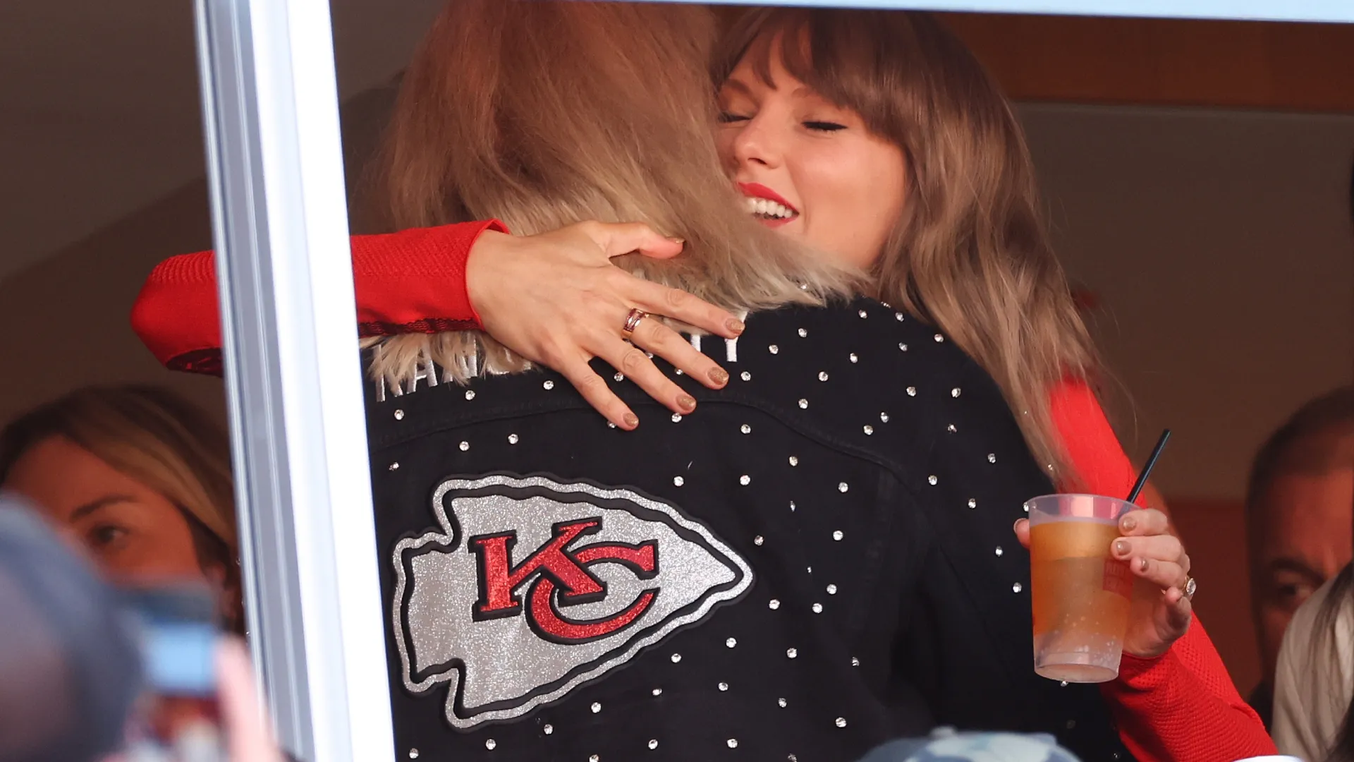 Donna Kelce hugs Taylor Swift during a game between the Chargers and the Chiefs (Source: Jamie Squire/Getty Images)