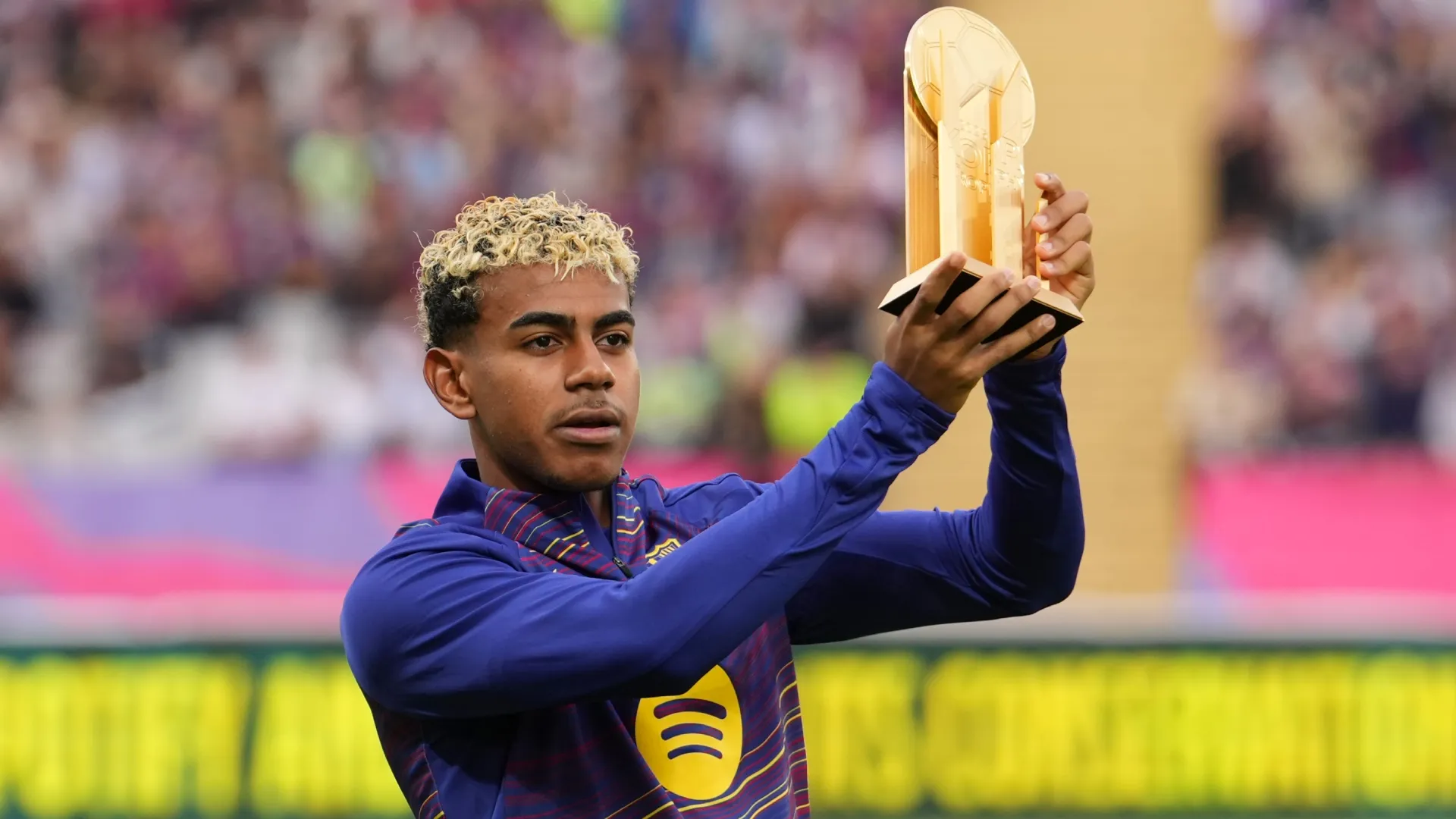 Lamine Yamal of FC Barcelona poses with the Kopa Trophy in 2025 (Source: Alex Caparros/Getty Images)