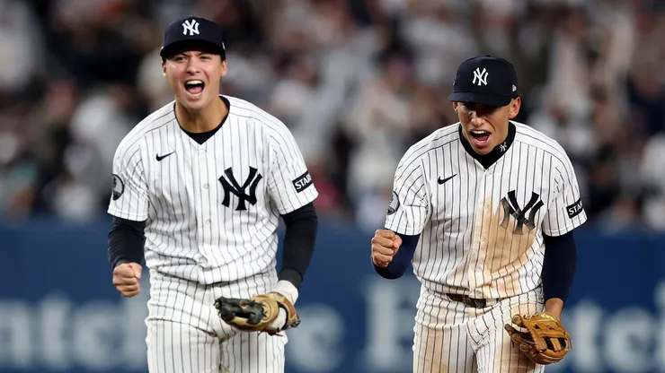 George Lombard Jr. #96 of the New York Yankees celebrates with Anthony Volpe #11.