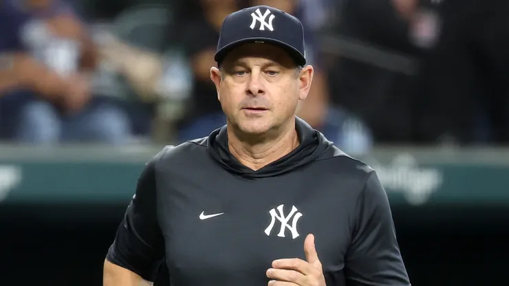 Manager Aaron Boone #17 of the New York Yankees walks to home plate.