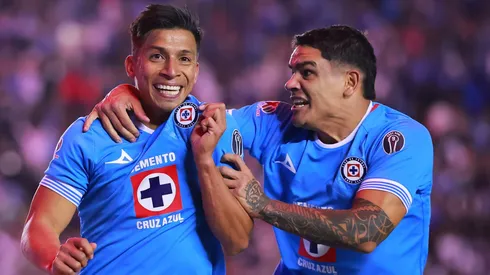 MEXICO CITY, MEXICO - NOVEMBER 30: Angel Sepulveda of Cruz Azul celebrates with teammate after scoring the team's third goal during the quarterfinals second leg match between Cruz Azul and Tijuana as part of the Torneo Apertura 2024 Liga MX at Estadio Ciudad de los Deportes on November 30, 2024 in Mexico City, Mexico. (Photo by Hector Vivas/Getty Images)
