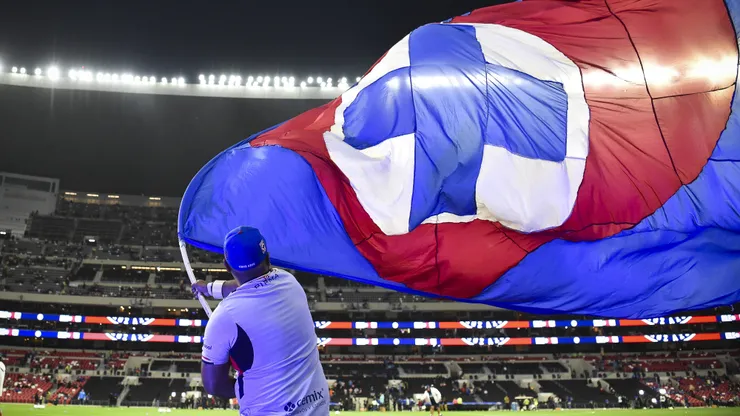 MEXICO CITY, MEXICO - MAY 13: A fan of Cruz Azul waves a flag prior to the semifinals first leg match between Cruz Azul and Chivas as part of the Torneo Clausura 2026 Liga MX at Banorte Stadium on May 13, 2026 in Mexico City, Mexico. (Photo by Rodrigo Oropeza/Getty Images)