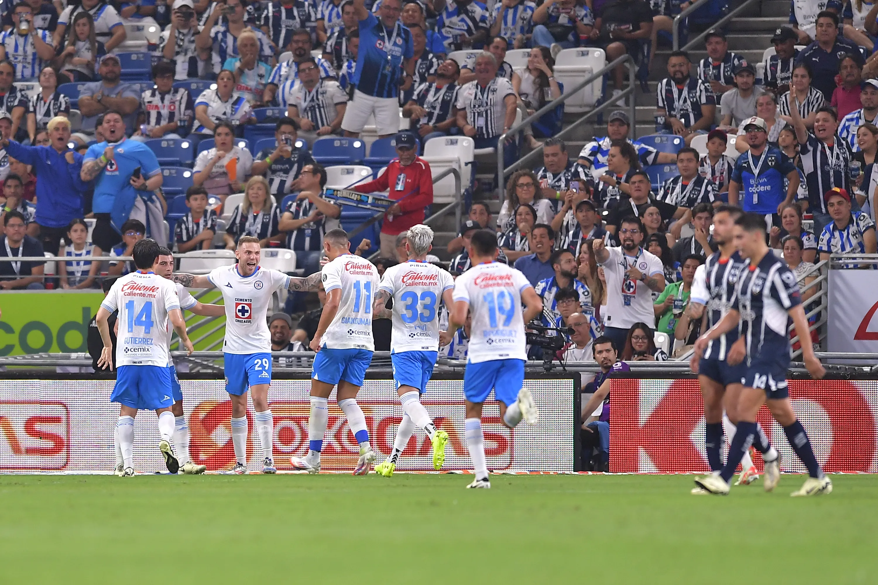 MONTERREY, MEXICO – JULY 13: Rodolfo Rotondi (2nd L) of Cruz Azul celebrates with teammates after scoring the team’s second goal via penalty during the 2nd round match between Monterrey and Cruz Azul as part of the Torneo Apertura 2024 Liga MX at BBVA Stadium on July 13, 2024 in Monterrey, Mexico. (Photo by Azael Rodriguez/Getty Images)