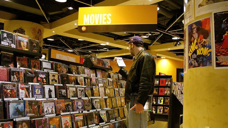NEW YORK - MAY 25: A man looks at DVD's in a store May 25, 2005 in New York City. According to a report issued this week by the Book Industry Study Group, the U.S. publishing industry continues to put out more books than the public is buying. As more people made a shift toward home video, DVD, Internet and cable, the number of books sold dropped by nearly 44 million between 2003 and 2004, even as the annual number of books published approaches 175,000. (Photo by Spencer Platt/Getty Images)