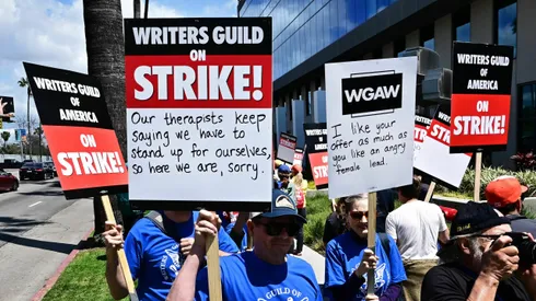 Writers picket in front of Netflix on Sunset Boulevard in Hollywood, California, on May 2, 2023 as the Writers Guild of America (WGA) goes on strike. - More than 11,000 Hollywood television and movie writers went on their first strike in 15 years, after talks with studios and streamers over pay and working conditions failed to clinch a deal. The strike means late-night shows are expected to grind to a halt immediately, while television series and movies scheduled for release later this year and beyond could face major delays. (Photo by Frederic J. BROWN / AFP) (Photo by FREDERIC J. BROWN/AFP via Getty Images)