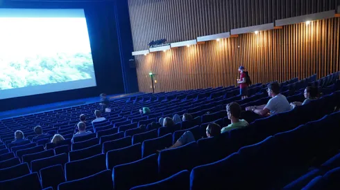 BERLIN, GERMANY - JULY 02: People arrive to watch a late night film at Kino International on the first day that cinemas reopened in Berlin during the novel coronavirus pandemic on July 02, 2020 in Berlin, Germany. Germany is continuing to lift lockdown restrictions nationwide while at the same time remaining wary of possible further outbreaks. (Photo by Sean Gallup/Getty Images)