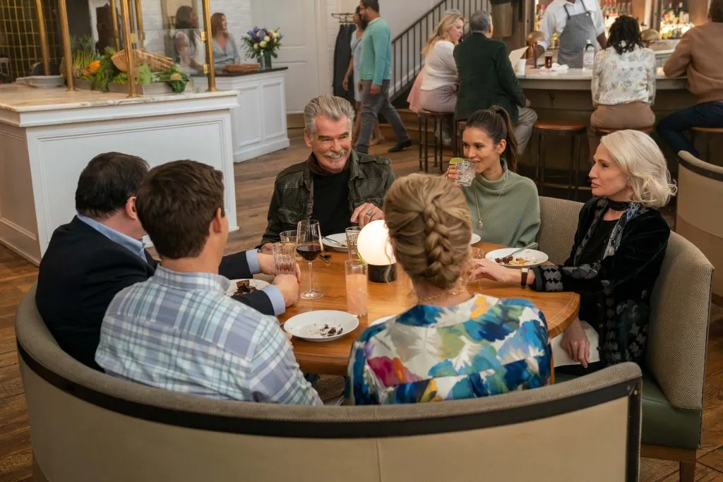 The Out-Laws. (L to R) Richard Kind as Neil Browning, Adam DeVine as Owen Browning, Pierce Brosnan as Billy McDermott, Julie Hagerty as Margie Browning, Nina Dobrev Parker McDermott, Ellen Barkin as Lilly McDermott in The Out-Laws. Cr. Scott Yamano/Netflix © 2023.